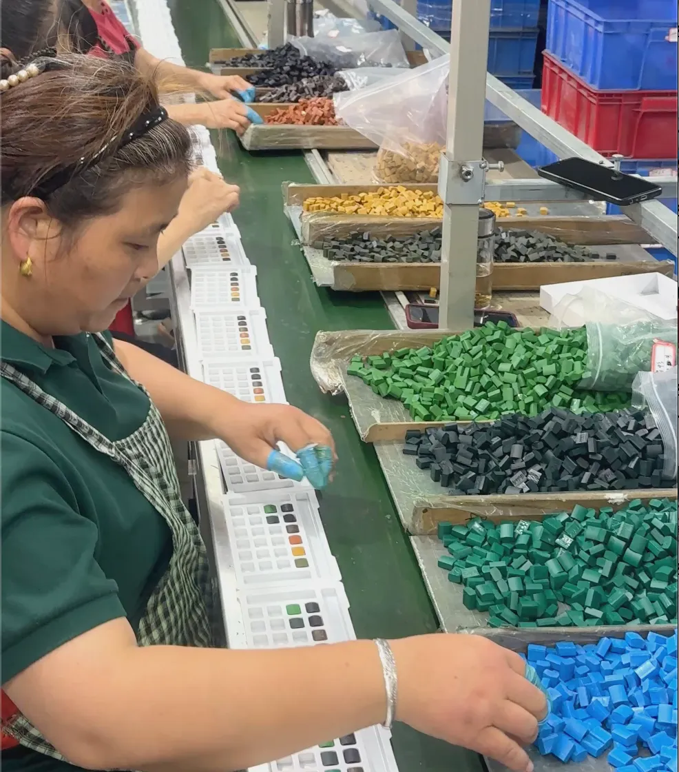 Quality inspection of wholesale watercolor sets by certified art supplier staff